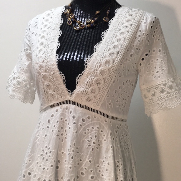 Shareen Dresses & Skirts - White Cotton Eyelet  Handkerchief Hem